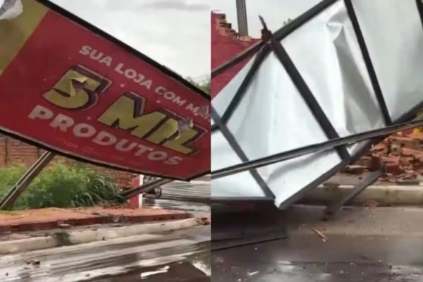 Muro com outdoor e árvores caem durante forte chuva em Teresina