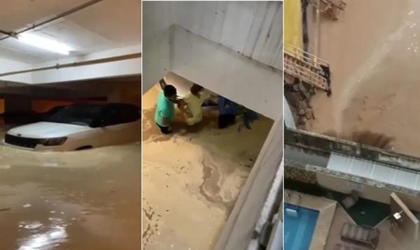 Muro rompe, água da chuva invade estacionamento e carros ficam quase submersos em condomínio de luxo